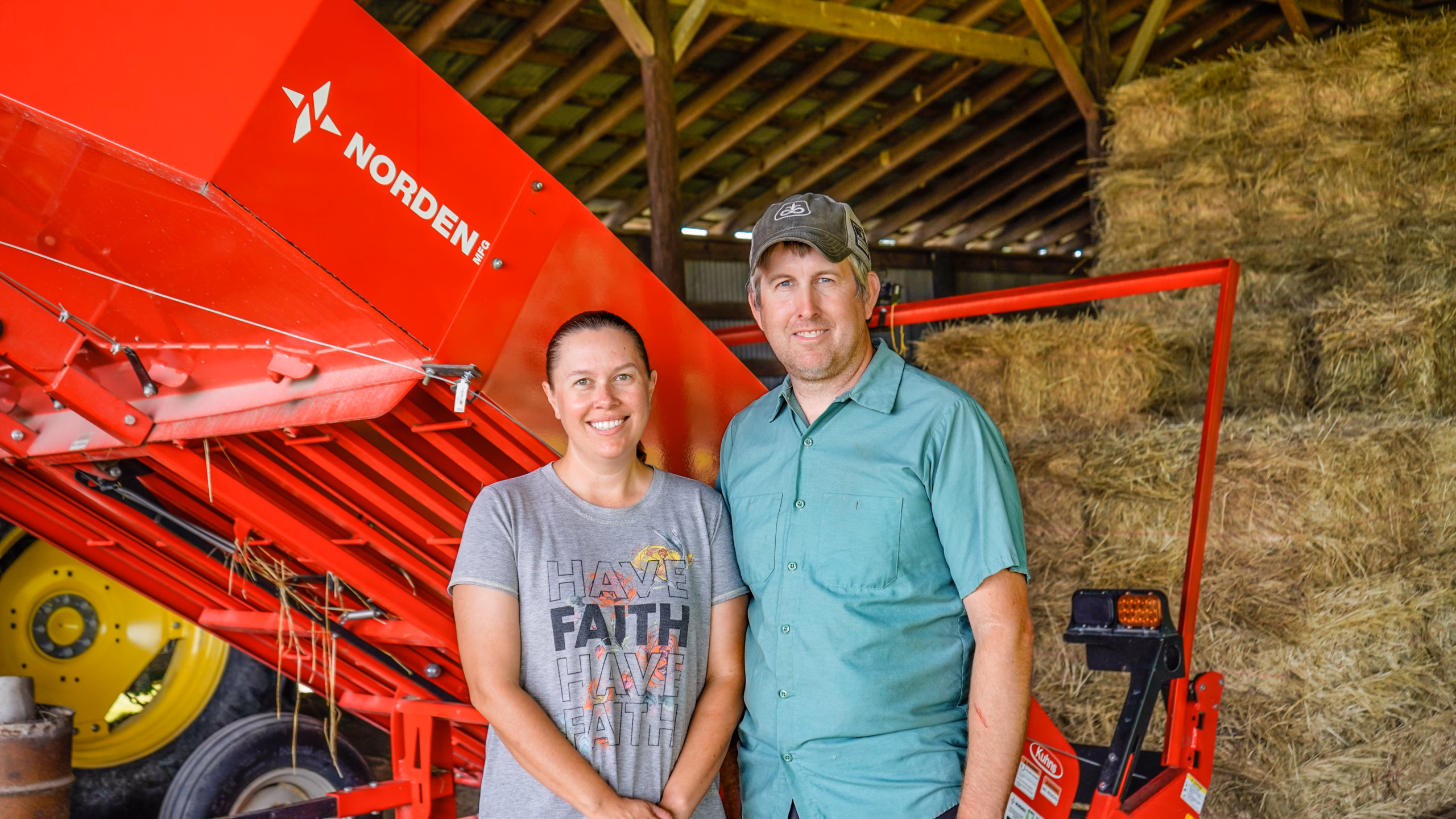 tractor and hay accumulator in a hay field on the davis farm in north carolina